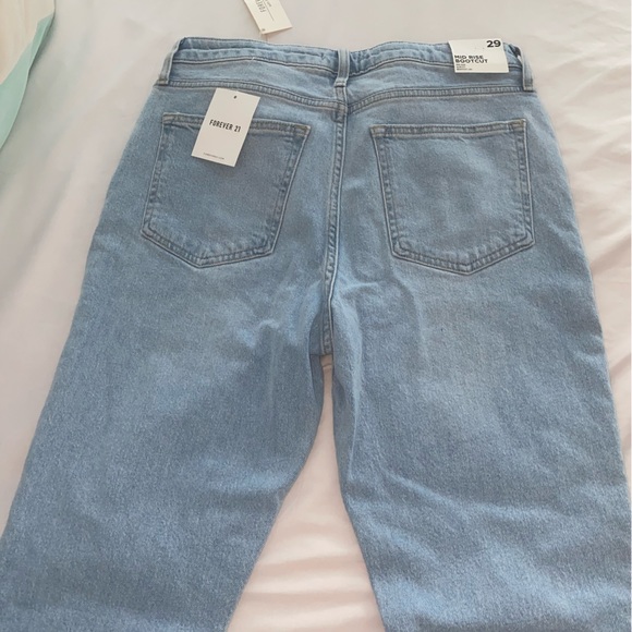 Mid Rise Bootcut Distressed Jeans - Picture 5 of 5